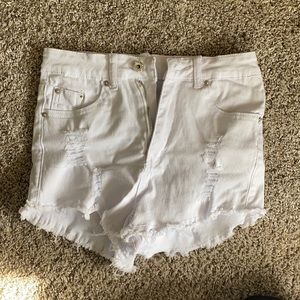 White ripped denim shorts